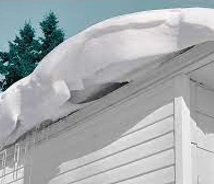 heavy snow on a residential home